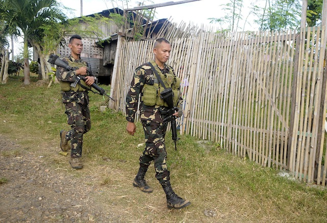  SEARCHING FOR SUSPECTS. Army soldiers search the village of Pagango in Barangay Gasi, Laguindingan town where two more suspects in the ambush-slay attempt on Iligan lawmaker Vicente Belmonte are believed to be hiding. MindaNews photo by Froilan Gallardo 
