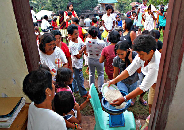 Evacuees queue to get their food rations from local authorities in Kitcharao town, Agusan del Norte last Monday, Nov. 7, 2011. At least 500 residents sought temporary refuge here after government forces launched air strikes against the New People's Army. MindaNews photo by Erwin Mascarinas