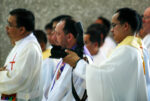 Fr. Eduardo Vasquez Jr. shoots video during the funeral mass for slain Italian missionary Fr. Fausto “Pops” Tentorio, PIME, in Kidapawan City on October 25, 2011. Mindanews File Photo by Keith Bacongco