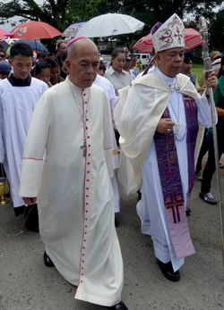Archbishop Romulo Valles of Zamboanga (left) has just been named by Pope Benedict XVI as the new Archbishop of Davao. This file photo of the Arcbhishop with Bishop Romulo dela Cruz of Kidapawan, was taken during the funeral procession for slain Italian missionary Fr. Fausto Tentorio in Kidapawan City on October 25, 2011. Mindanews Photo by Keith Bacongco