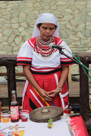 Bae Inatlawan Adelina Tarino, head claimant of the Bukidnon-Daraghuyan Ancestral Domain, leads a ritual during the tribal Olympics in Malaybalay City on March 1, 2012. MindaNews file photo by H. Marcos C. Mordeno