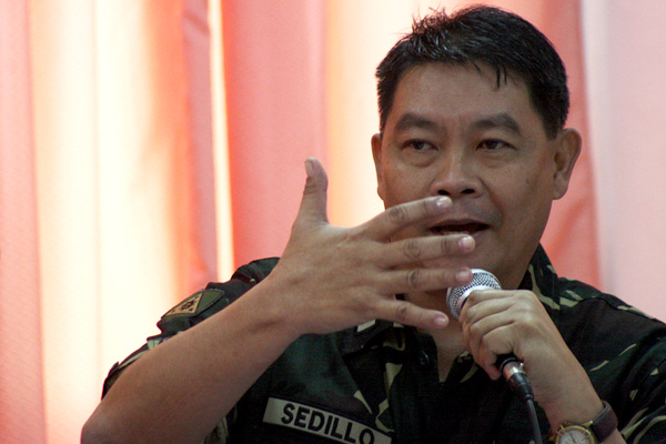 Brigadier General Cesar Sedillo, Assistant Division Commander of the 6th Infantry Division answers questions from members of the Congressional Committee on Human Rights during a public hearing in Davao City on Friday, November 9. Sedillo was questioned regarding the killing of Italian missionary Fr. Fausto "Pops" Tentorio in Arakan, North Cotabato last year. Arakan is under the 6th ID. MindaNews Photo by Ruby Thursday More