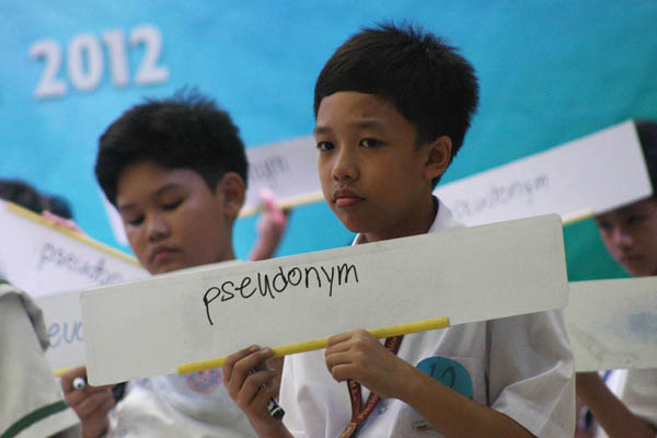 CORRECT SPELLING. A student shows his answer to a spelling bee question during a constest in celebration of the National Book Week organized by the Davao City Public Library. MindaNews photo by Ruby Thursday More