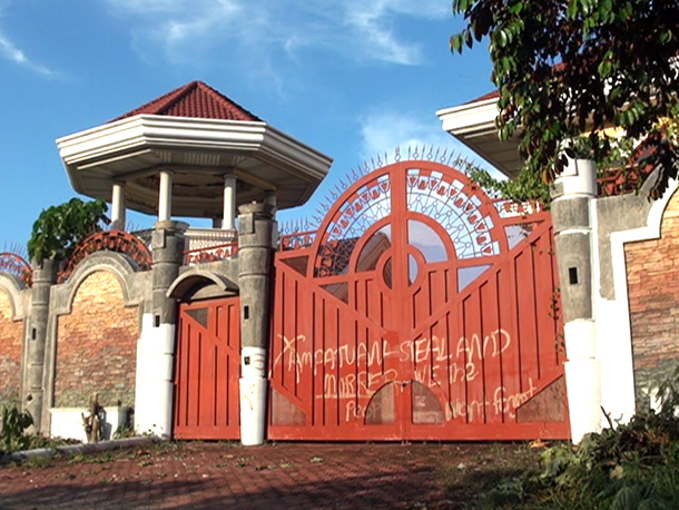 BIGGER, BETTER. The tall gates conceal the mansion in Juna Subdivision, Davao City, that is owned by Andal Ampatuan Sr. PCIJ Photo