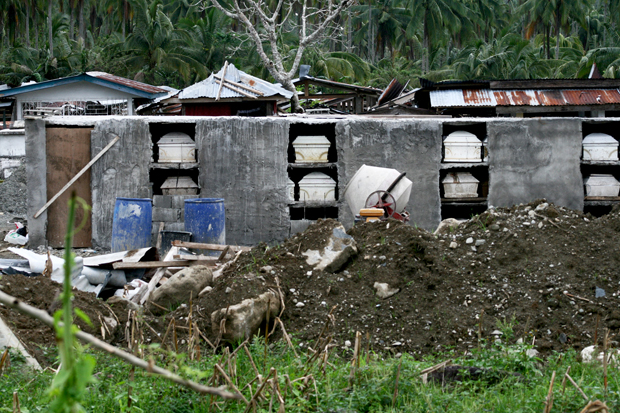 The unsealed tombs of the fatalities in New Bataan, Compostela Valley province. The victims were swept by flashfloods triggered by super typhoon Pablo on December 4. Photo taken on December 27, 2012. Mindanews Photo by Ruby Thursday More
