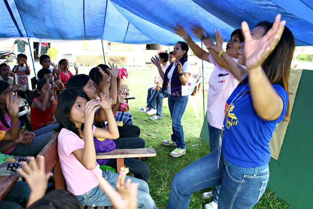Teachers conduct their classes inside tents in Baganga Central Elementary School in Baganga town on January 3, 2012 , after typhoon Pablo destroyed most of the schools in Davao Oriental. MindaNews photo by Erwin Mascarinas