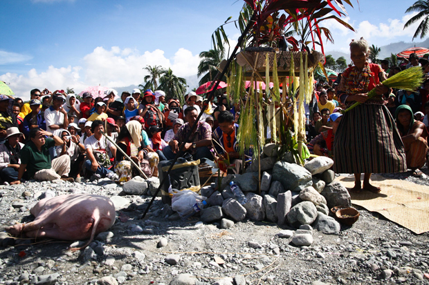 Indigenous peoples hold a ritual on the rocks, in the site which used to be the center of Barangay Andap in New Bataan, Compostela Valley Province on Monday on the 41st day since December 4, 2012. MindaNews Photo by Ruby Thursday More