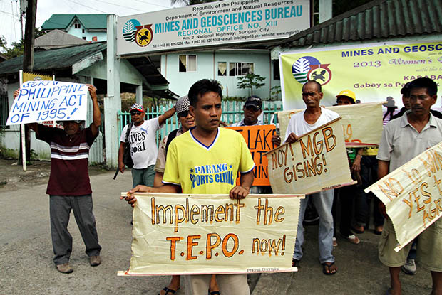 Residents from the town of Cantilan and other parts of Surigao del Sur march on the streets in Surigao City Monday afternoon to protest the non-enforcement by the Mines and Geosciences Bureau regional office of the Temporary Environmental Protection Order issued in 2010 against Marcventures Mining and Development Corp's operations in Cantilan's watershed. MindaNews photo by Erwin Mascarinas