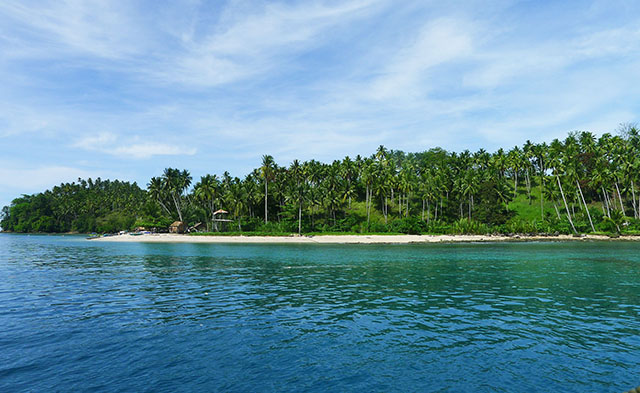 LIVING IN PARADISE. Balut Island in Kalamansig, Sultan Kudarat remains sparsely inhabited. White sand beaches dot the island surrounded by scuba diving and snorkeling sites. MindaNews photo by Bong S. Sarmiento