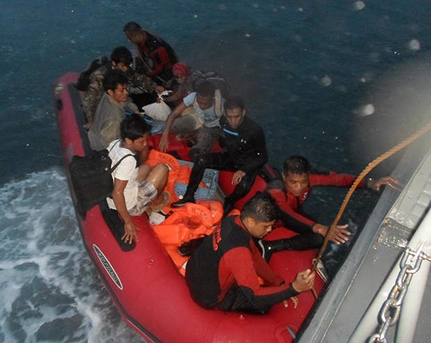 RESCUED. Navy personnel (in black and red suits) prepare to board the Multi-Purpose Attack Craft with some of the tourists they rescued Saturday at the Greater Sta. Cruz Island, about 1.9 nautical miles off Zamboanga City. Photo courtesy of the Naval Forces Western Mindanao