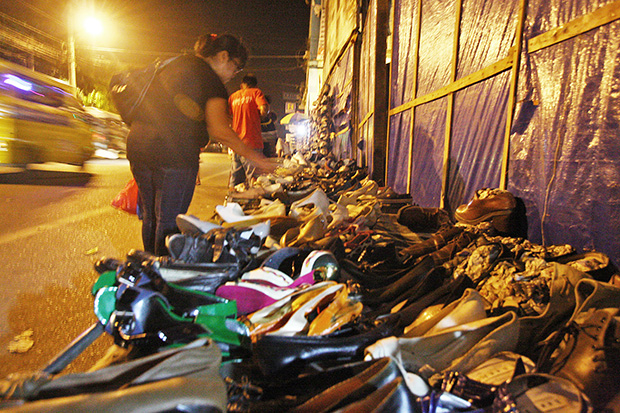Second hand or ukay-ukay shoes are sold at the sidewalk along Magallanes Street in Davao City on Tuesday, October 1, 2013. MindaNews photo by Ruby Thursday More