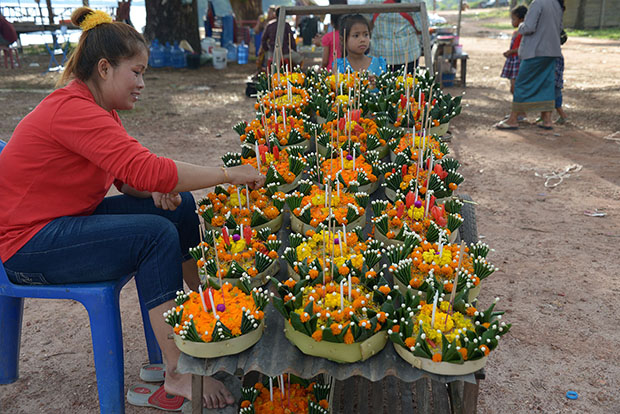 A village woman in Vientiane sells "kathong", several bouquets of flowers, candles and incense with banana trunk as platform that were later floated on the Mekong River to mark the end of the Buddhist Lent. MindaNews photo by Lorie Ann Cascaro