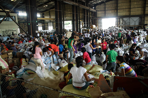 At least 1,500 volunteers troop to the Department of Public Works and Highway (DPWH) depot on Saturday, Nov. 16, 2013, to help in the repacking of relief goods for the survivors of super typhoon Yolanda in the Visayas. MindaNews photo by Keith Bacongco