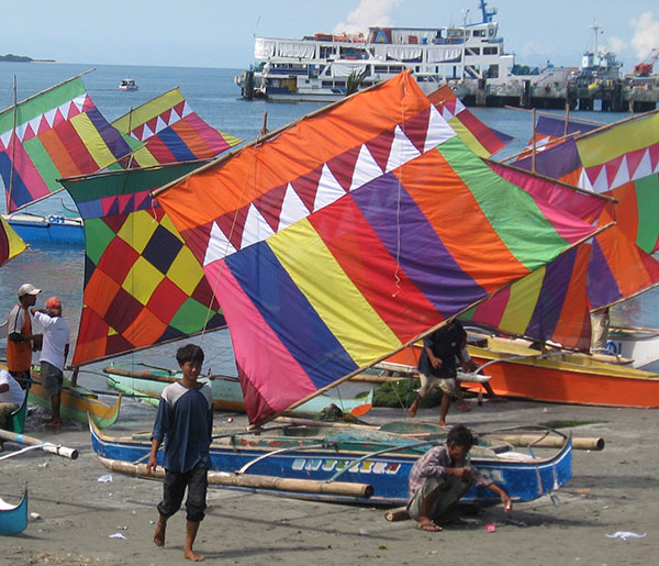 The Badjaos employed through the “Regatta de Esperanza” by the Department of Tourism (DOT) take a breather following its launching Tuesday (3 Dec. 2013) at the shore of Paseo del Mar. The regatta is aimed to provide short term employment to Badjaos displaced by the siege last September in Zamboanga City. 