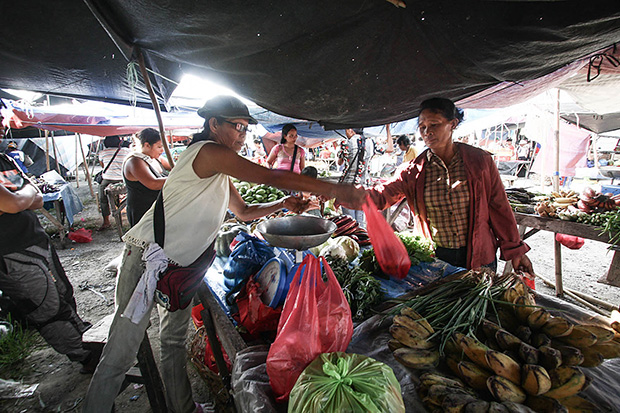Vegetable vendor Melodiya Dagandan at her stall in the market of New Bataan, Compostela Valley province on December 4, 2013. MindaNews Photo by Ruby Thursday More