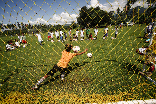 Kids under the Social Sports School of ANAKK-Sta Cruz practice their kicking skills on Saturday, 26 April, in Sta. Cruz Davao del Sur. Football giant Realmadrid FOundation and Fundacion Mapfre handed them at least 40 footballs as part of their continuing support to the children Mindanews Photo by Ruby Thursday More