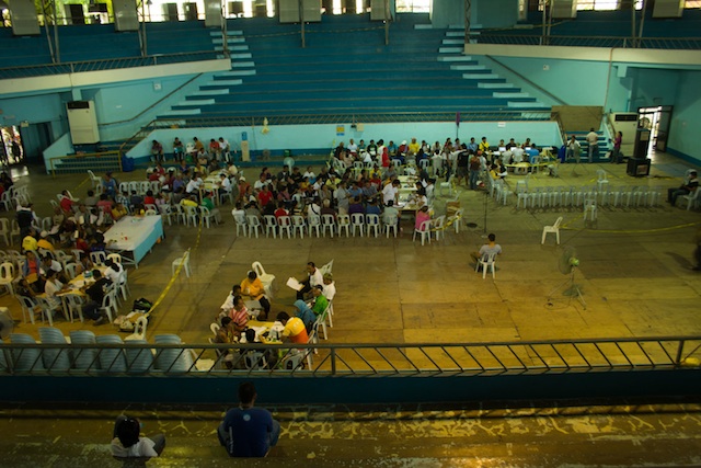 EMPTY BLEACHERS. While claimants wait outside the gym, the bleachers inside await occupants. MindaNews photo by Toto Lozano 