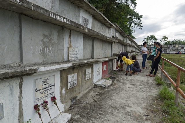 FADING. The numbered graves at the public cemetery in Barangay Palao, Iligan City, represent unidentified victims of the December 2011 typhoon Sendong whose DNA samplings are supposed to be matched with surviving relatives. In some niches, the numbers could hardly be read as the white paint has faded. ILDO-11, the code preceding the victim’s number, refers to Iligan District Office, 2011. MindaNews photo by Bobby Timonera
