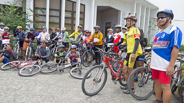 Home, at last! Fr. Picx and biking buddies at the Redemptorist Church in Iligan. MindaNews photo by Bobby Timonera