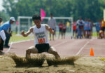 An athlete lands on the sand during the opening game of the long jump at the Palarong Pambansa in Tagum City, Davao del Norte on Sunday, May3. Mindanews Photo by Keith Bacongco