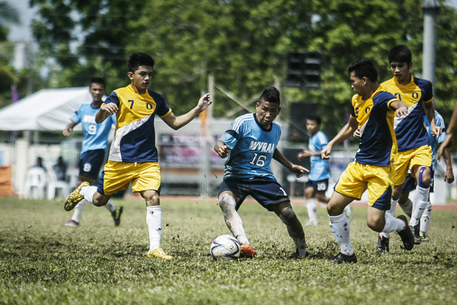 Players fight for the ball in the championship match on Saturday of the secondary football game between National Capital Region and Western Visayas Region during the Palarong Pambansa in Tagum City, Davao del Norte. Western Visayas Region captured its first ever crown in the secondary football after a shootout. Mindanews Photo by Keith Bacongco