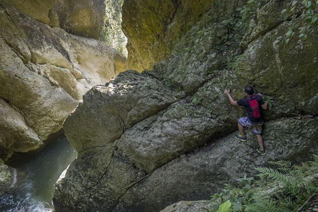 “Gollum Falls” is not for the faint of heart, as Dagul finds as he hangs onto rocks. MindaNews photo by Bobby Timonera