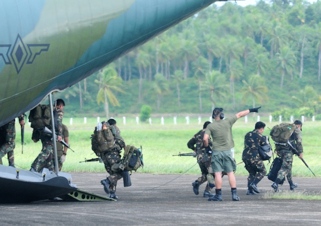 ARMY DEPLOYMENT. Soldiers of the Army’s 16th Infantry Battalion from Mindoro arrived by C-130 plane in Tandag, Surigao Del Sur on Wednesday, Jan. 20, 2015 for deployment against the New People’s Army. Four battalions are now currently deployed in Surigao del Sur province. MindaNews photo by Froilan Gallardo ARMY DEPLOYMENT. Soldiers of the Army 16th Infantry Battalion arrived by C-130 plane in Tandag, Surigao Del Sur on Wednesday, Jan. 20, 2015. More soldiers are deployed to augment troops fighting the communist insurgency. Four battalions are now currently deployed in Surigao del Sur province. MindaNews photo by Froilan Gallardo