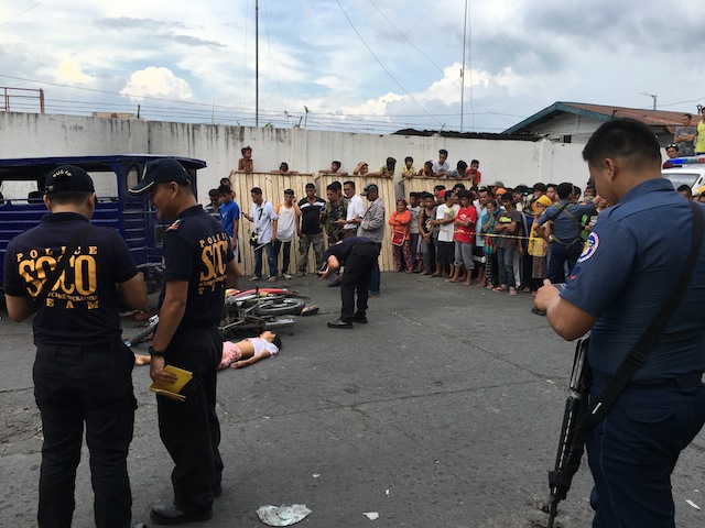 Scene of the crime operatives investigate the crime scene in Cotabato City where four persons were killed, including two children. MindaNews photo by FERDINANDH B. CABRERA 