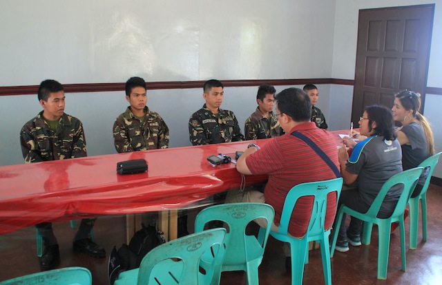 Members of the Anti-Torture unit of the Commission on Human Rights central office interview Army Cpl. Sandy Batolbatol (center), SCAA members (left to right) Jerome Saniel, JP Palaruan, Christian Dawata and CAA member Randy Sulutan at the 72nd Infantry Battalion camp in Mawab, Compostela Valley on March 19, 2016. The five have been relieved and confined to quarters at the camp for allegedly tortuing a Tagakolu farmer, his 15-year old son and 14-year old grandnephew at the suspects' detachment in Barangay Demoloc, Malita, Davao Occidental on February 19. MindaNews photo by GG BUENO