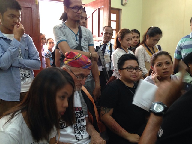 Singer Aiza Seguerra and her partner Liza Dino with Fr. Peter Geremia, assistant parish priest of Arakan in North Cotabato, at the hearing Wednesday on the motion to reduce bail for the provisional release of the 77 farmers detained in the aftermath of the violent dispersal on the third day of the barricade on April 1. MindaNews photo by CAROLYN O. ARGUILLAS 