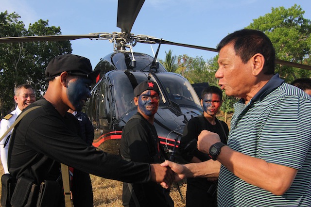 PEACE. Members of the New People's Army welcome Davao City Mayor and Presidential frontrunner Rodrigo Duterte upon his arrival to receive Army Private First Class Edgardo Hilaga of the 7th Infantry Battallion in an upland village in Tulunan, North Cotabato on April 26, 2016. Hilaga was freed by the NPA after five days in captivity. MindaNews photo by TOTO LOZANO