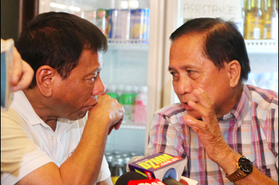 Incoming president Rodrigo Duterte chats with returning Presidential Adviser on the Peace Process Jesus Dureza during a press conference at Hotel Elena in Davao City Saturday night, May 28, 2016. Mindanews photo by KEITH BACONGCO 