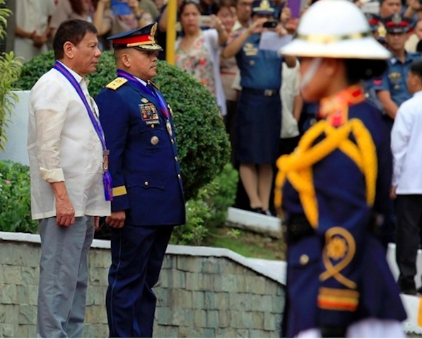 Philippine National Police Director-General Ronald dela Rosa beside President Rodrigo Duterte at the assumption of command in Camp Crame, Quezon City on July 1, 2016. KIWI BULACLAC/Presidential Photographers Division 
