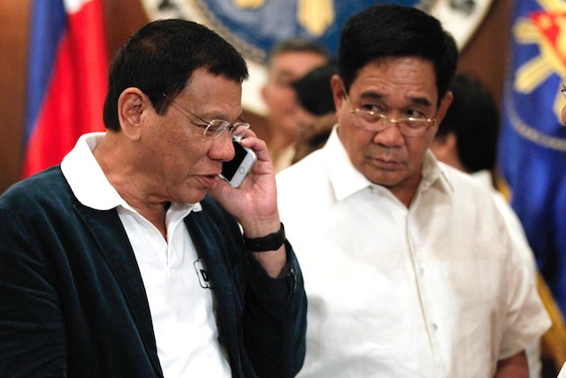HELLO NUR. President Rodrigo Duterte calls Moro National Liberation Front (MNLF) founding chair Nur Misuari after approving the Peace Roadmap presented by Presidential Adviser on the Peace Process Jesus Dureza at the State Dining Room in Malacañan Palace on Monday evening, July 18, 2016. Beside the President is National Security Adviser Hermogenes Esperon Jr. TOTO LOZANO/PPD