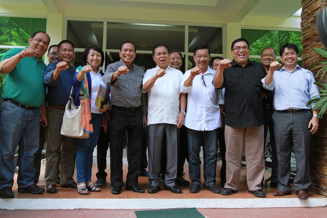 Presidential Adviser on the Peace Process Jesus Dureza and MILF Chair Al Haj Murad Ebrahim and other officials of government and the MILF clench their fists ala President Duterte, for a souvenir photo after Dureza met with Murad and the MILF Central Committee in Camp Darapanan, Sultan Kudarat, Maguindanao early morning Friday, 21 July 2016. MindaNews photo by KEITH BACONGCO 