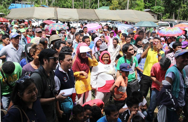 Hundreds of residents in Barangay Baguindan, Tipo-Tipo, Basilan gather to witness the turnover of a former Abu Sayyaf camp on Sunday, September18. The military overran the camp on 12 August as part of the government crackdown against the terror group. Photo by Amir Mawallil 