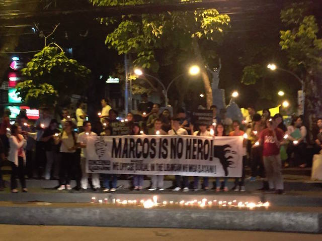 MARCOS IS NO HERO. Kagay-anons gathered spontaneously in Divisoria, this city, to register their dismay and indignation hours after the Supreme Court voted 9-5-1 to junk the petition not to allow a hero's burial to dictator Ferdinand Edralin Marcos in the Libingan ng mga Bayani. Photo by Cong B. Corrales
