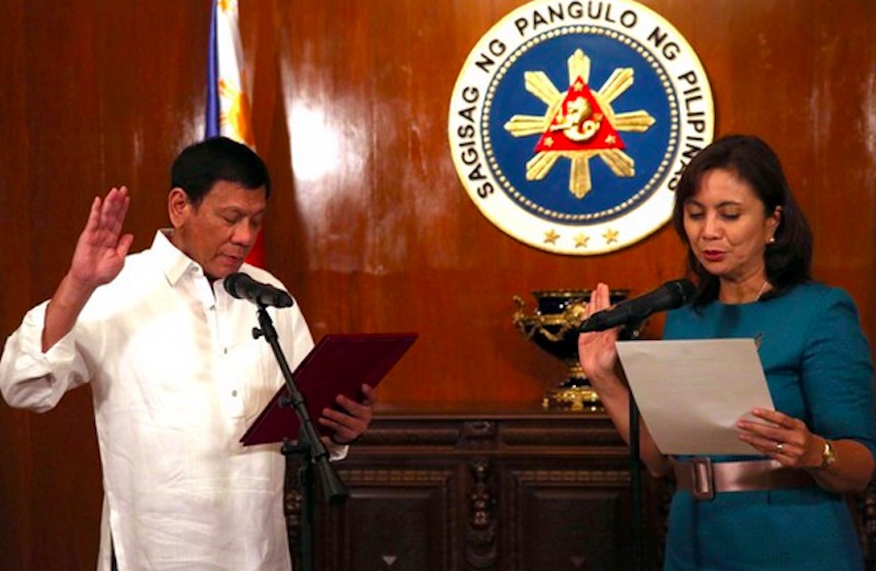 President Rodrigo R. Duterte administers the oath of office to Vice-President Maria Leonor G. Robredo, during her inauguration as Housing and Urban Development Coordinating Council (HUDCC) Secretary at the Malacañan Palace on July 12. TOTO LOZANO/PPD 